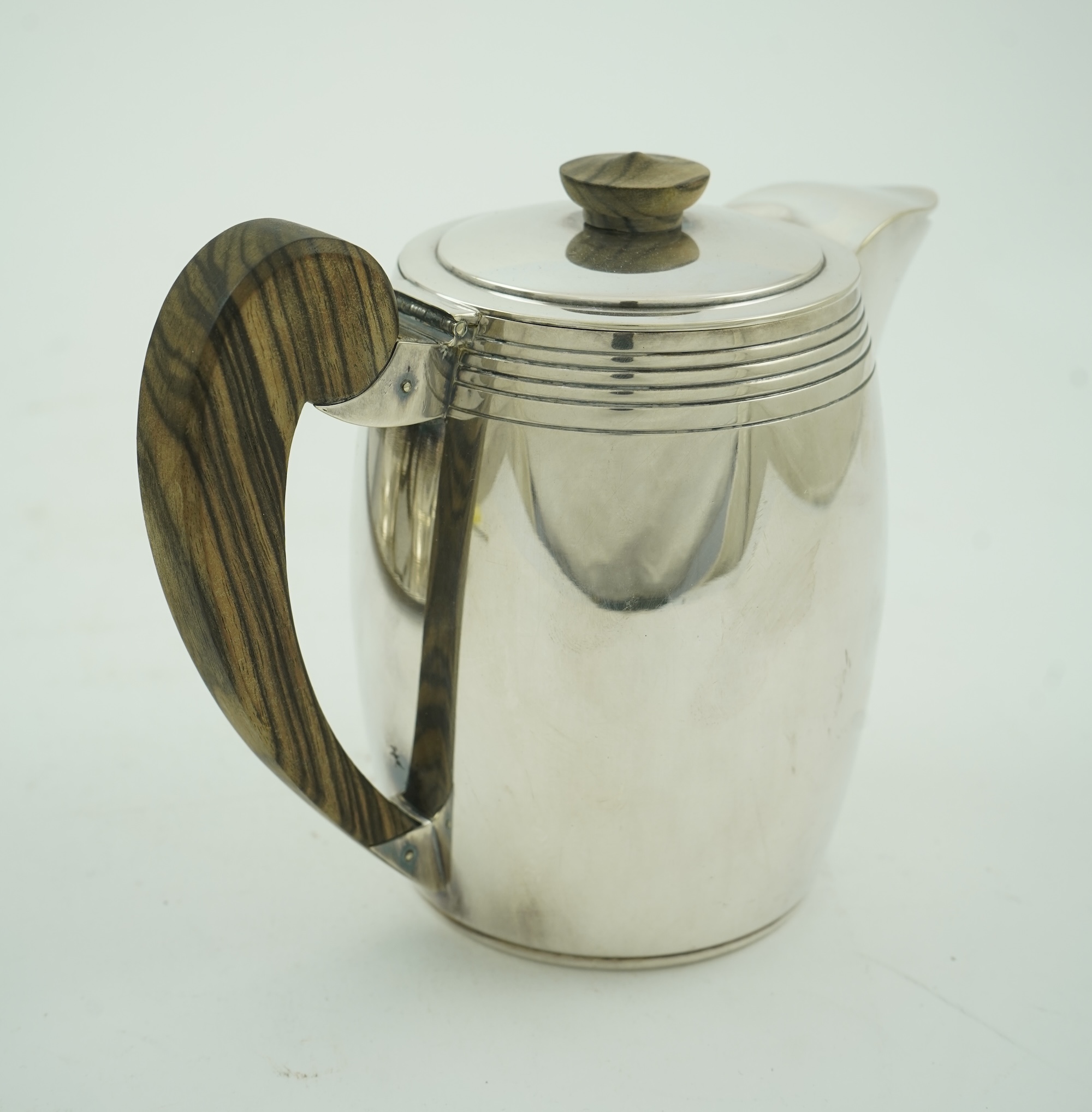 An Ercuis Art Deco silver plated Macassar handled four piece tea or coffee set